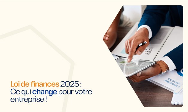 Deux professionnels examinent des graphiques financiers sur une tablette, illustrant les changements de la loi de finances 2025 pour les entreprises.